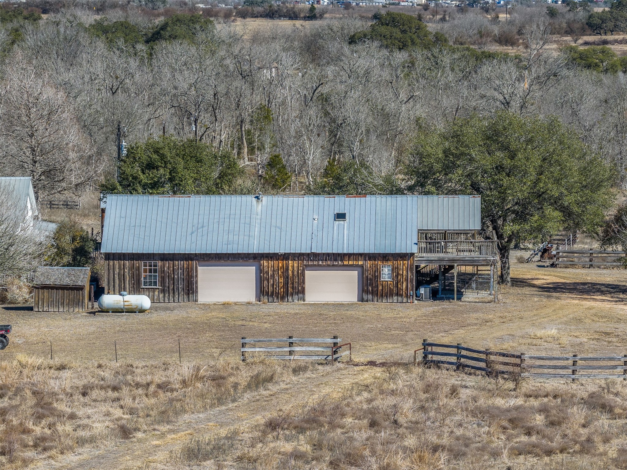 2998 Highway 237 Round Top, TX 78954 - Photo 4 of 43 an aerial view of a house with a yard covered by trees