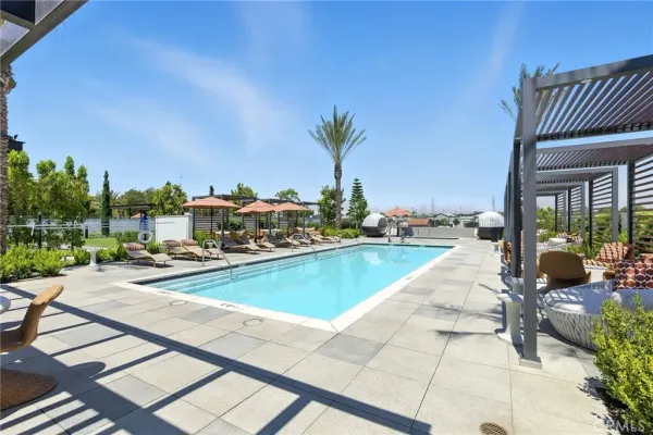 a view of swimming pool with outdoor seating and a terrace