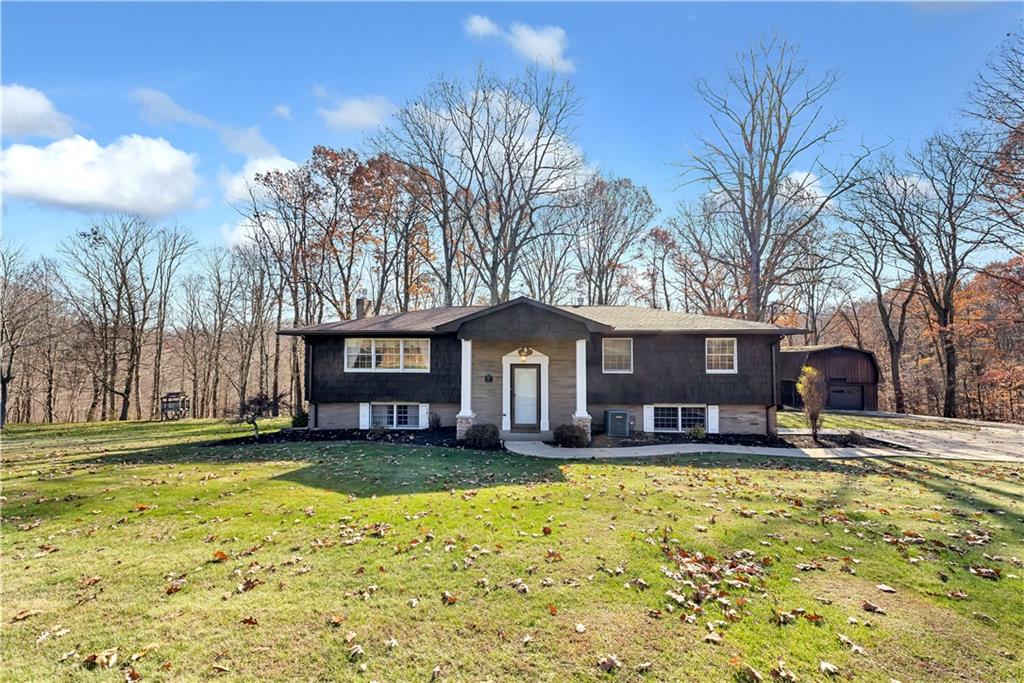 a view of a house with a yard covered with snow in front of house