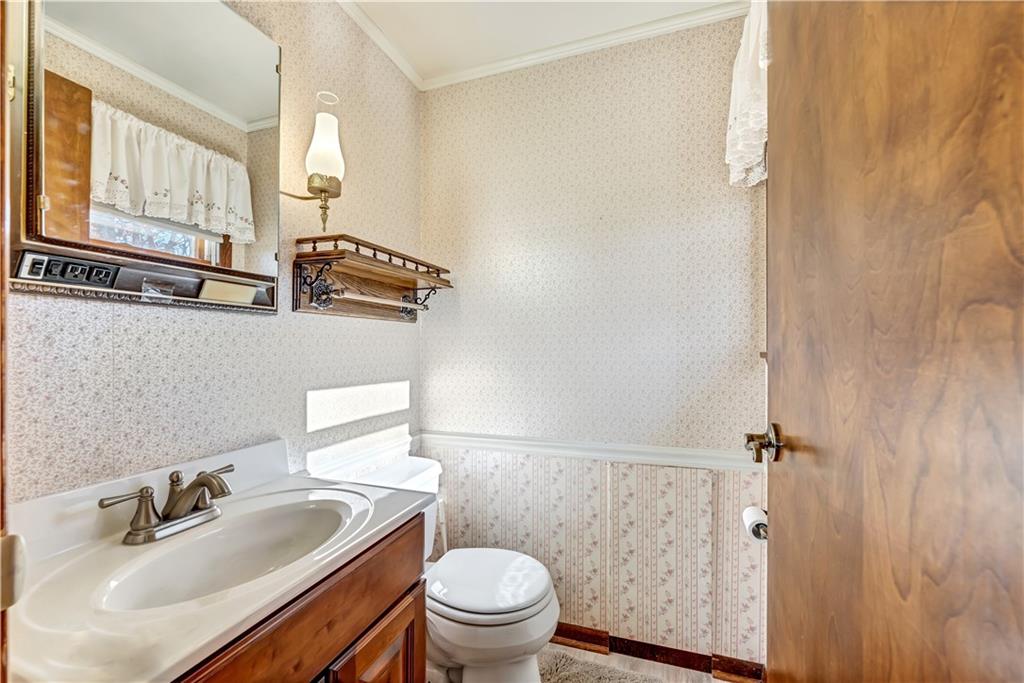 18 Colwell Street Burgettstown, PA 15021 - Photo 11 of 39 a bathroom with a sink a toilet and a mirror