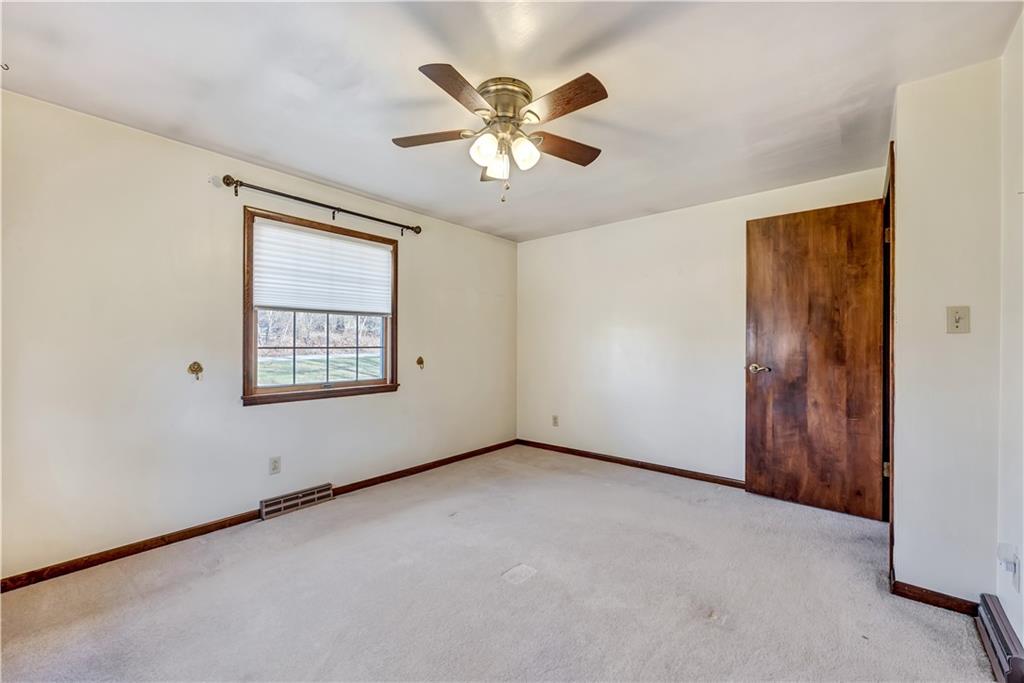 18 Colwell Street Burgettstown, PA 15021 - Photo 13 of 39 an empty room with ceiling fan and windows