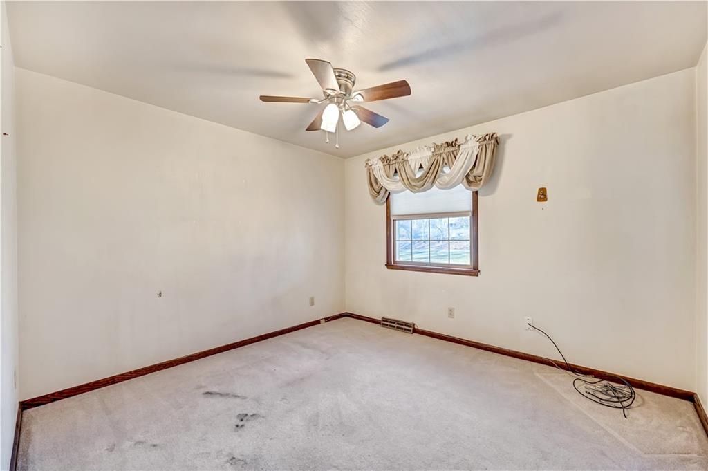 18 Colwell Street Burgettstown, PA 15021 - Photo 14 of 39 an empty room with windows and fan