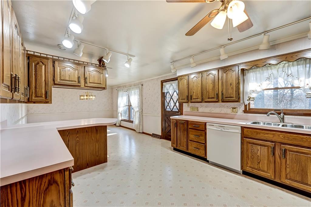 18 Colwell Street Burgettstown, PA 15021 - Photo 15 of 39 a large kitchen with stainless steel appliances kitchen island granite countertop a sink and dishwasher a stove with wooden floor