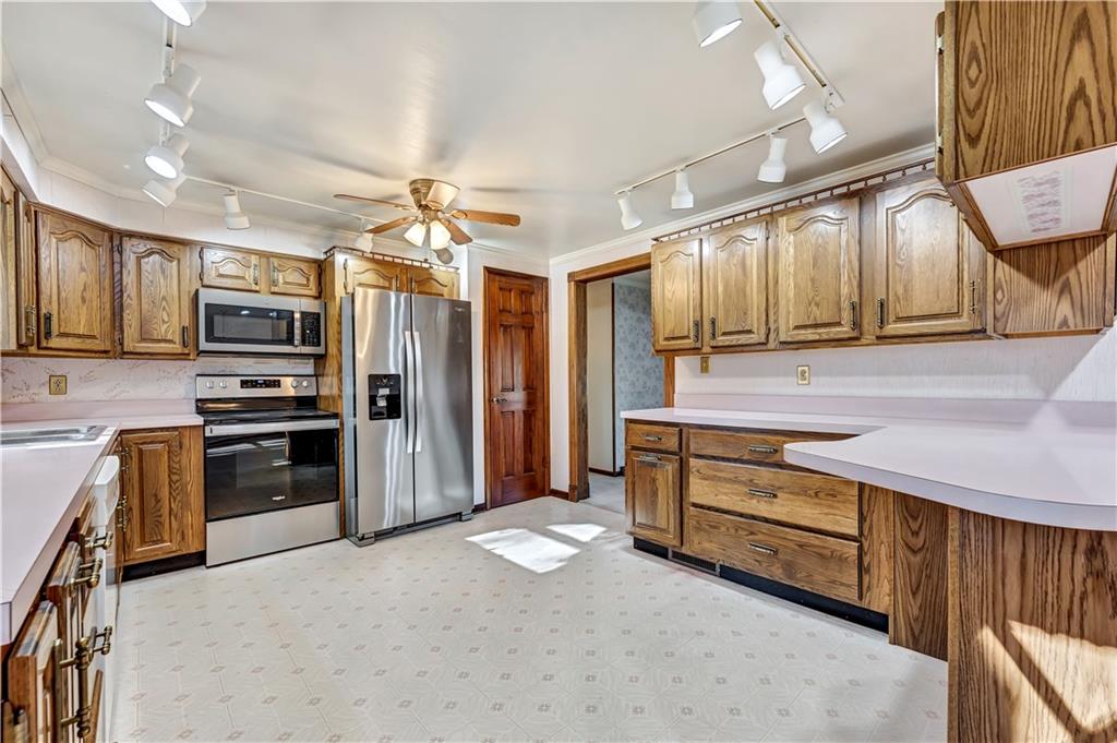 18 Colwell Street Burgettstown, PA 15021 - Photo 16 of 39 a kitchen with stainless steel appliances a stove a sink and a refrigerator
