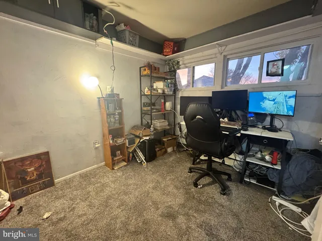 a view of a workspace with furniture