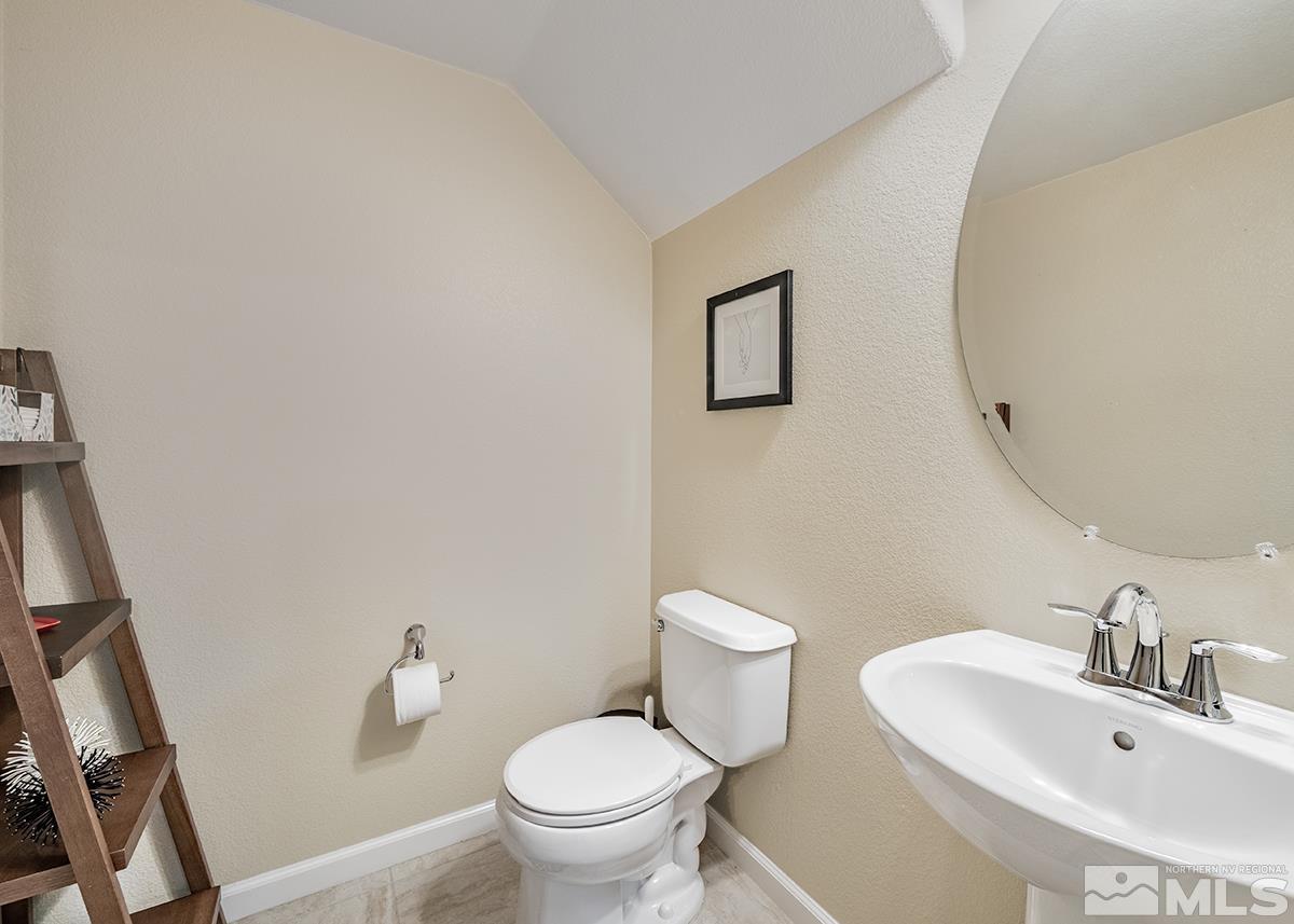 1865 Wind Ranch Road, Unit B Reno, NV 89521 - Photo 11 of 26 a bathroom with a sink and a mirror