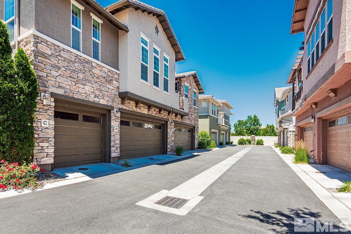 1865 Wind Ranch Road, Unit B Reno, NV 89521 - Photo 22 of 26 a front view of a building with a garden