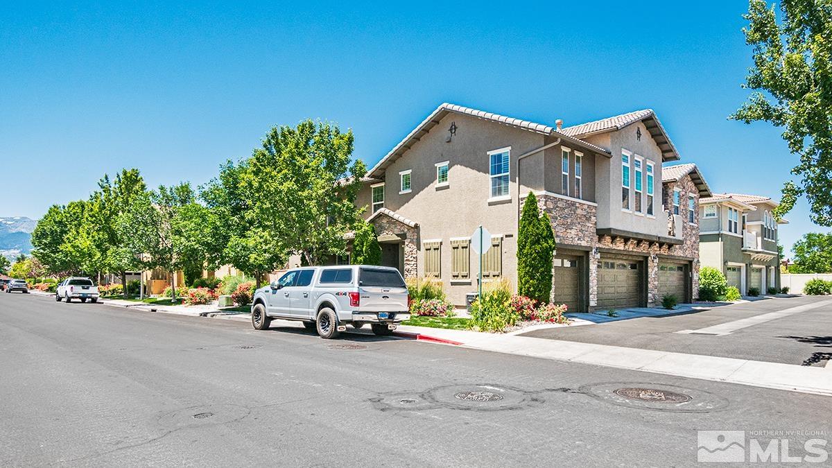 1865 Wind Ranch Road, Unit B Reno, NV 89521 - Photo 24 of 26 a car parked in front of a building