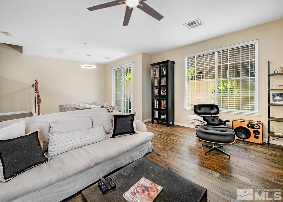 1865 Wind Ranch Road, Unit B Reno, NV 89521 - Photo 5 of 26 a living room with furniture and a large window