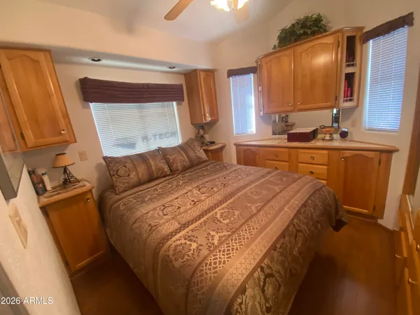a bedroom with a bed and a mirror