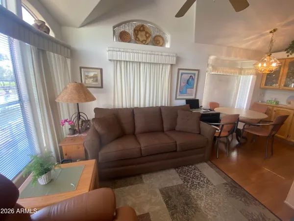 a living room with furniture and a window