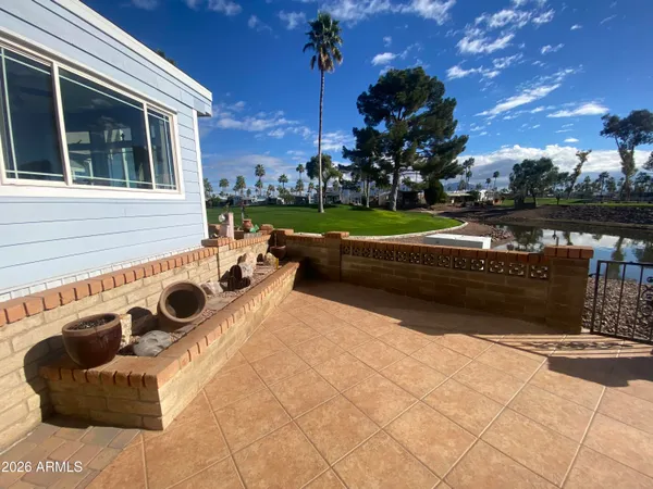 a view of swimming pool having outdoor seating