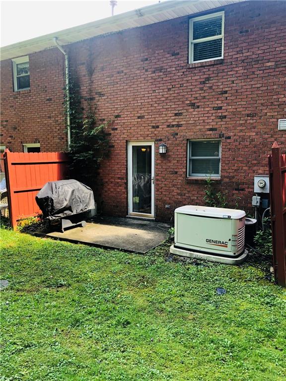 4864 Lucerne Road, Unit 4864 Indiana, PA 15701 - Photo 3 of 18 a building with garden in front of it
