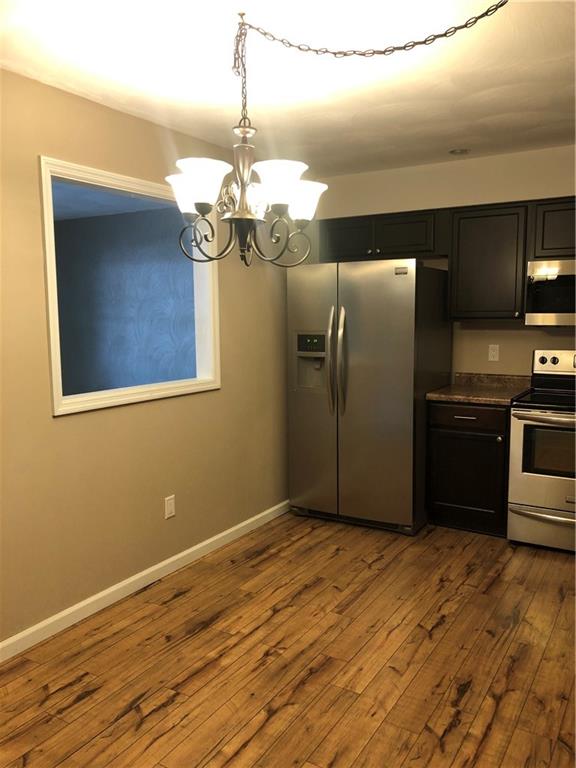 4864 Lucerne Road, Unit 4864 Indiana, PA 15701 - Photo 5 of 18 a kitchen with stainless steel appliances granite countertop a refrigerator and a stove top oven