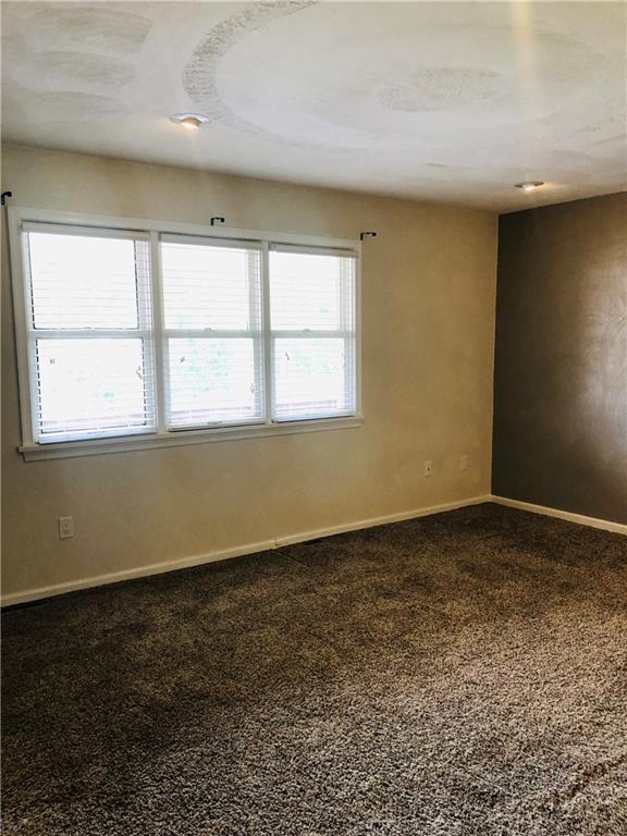 4864 Lucerne Road, Unit 4864 Indiana, PA 15701 - Photo 8 of 18 an empty room with a empty space and windows