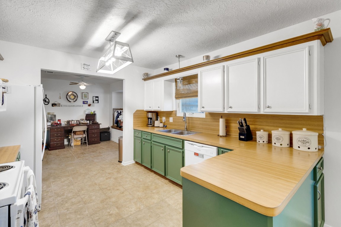 144 Thornton Road Trinity, TX 75862 - Photo 13 of 39 a kitchen with sink cabinets and living room