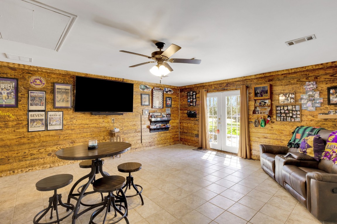 144 Thornton Road Trinity, TX 75862 - Photo 23 of 39 a living room with furniture and a flat screen tv