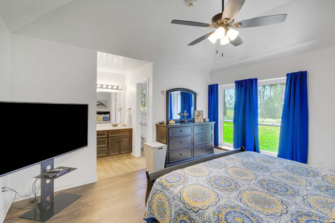 144 Thornton Road Trinity, TX 75862 - Photo 26 of 39 a bedroom with a bed and a flat screen tv
