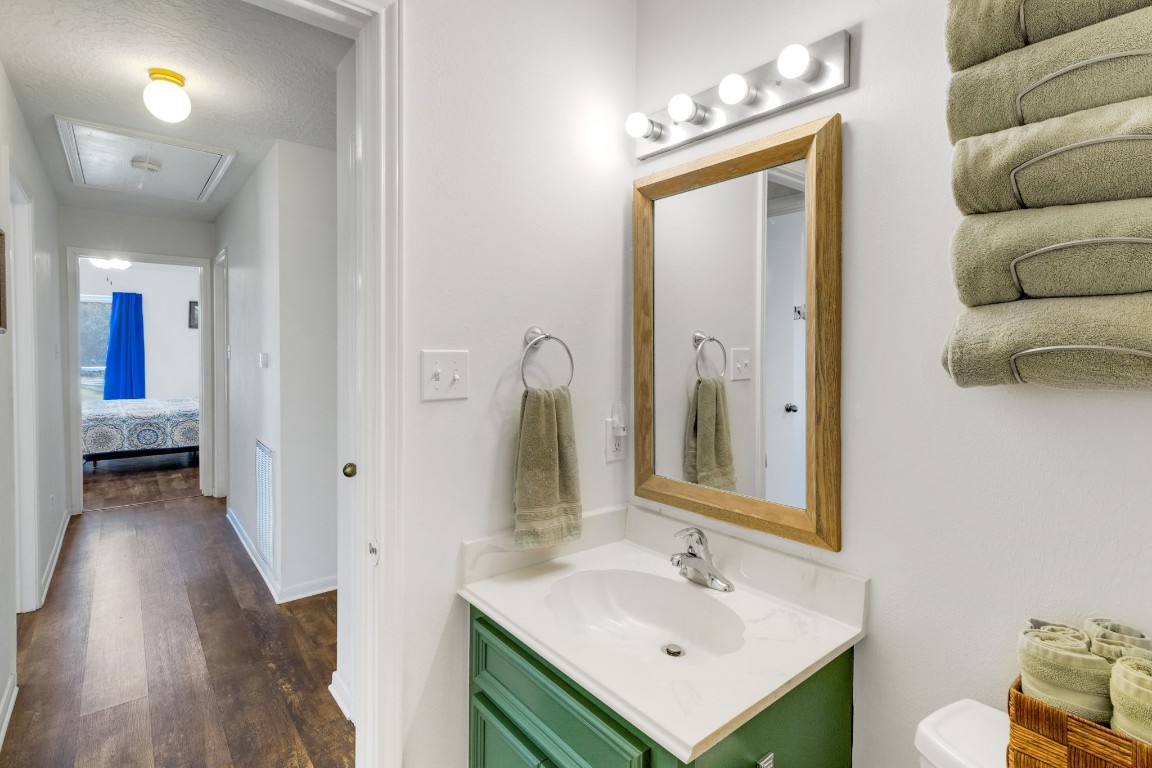 144 Thornton Road Trinity, TX 75862 - Photo 33 of 39 a en suite bathroom with a sink and a mirror