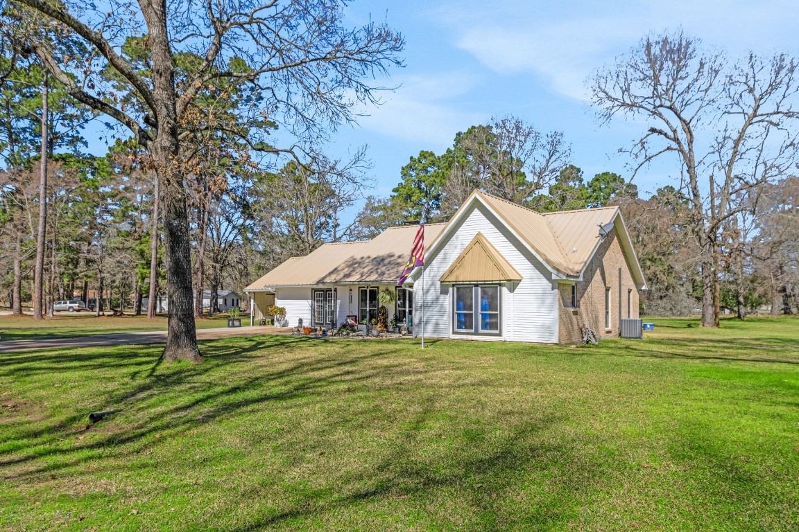 144 Thornton Road Trinity, TX 75862 - Photo 4 of 39 a view of a house with a yard