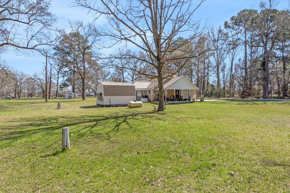 144 Thornton Road Trinity, TX 75862 - Photo 6 of 39 a view of a house with yard and tree s