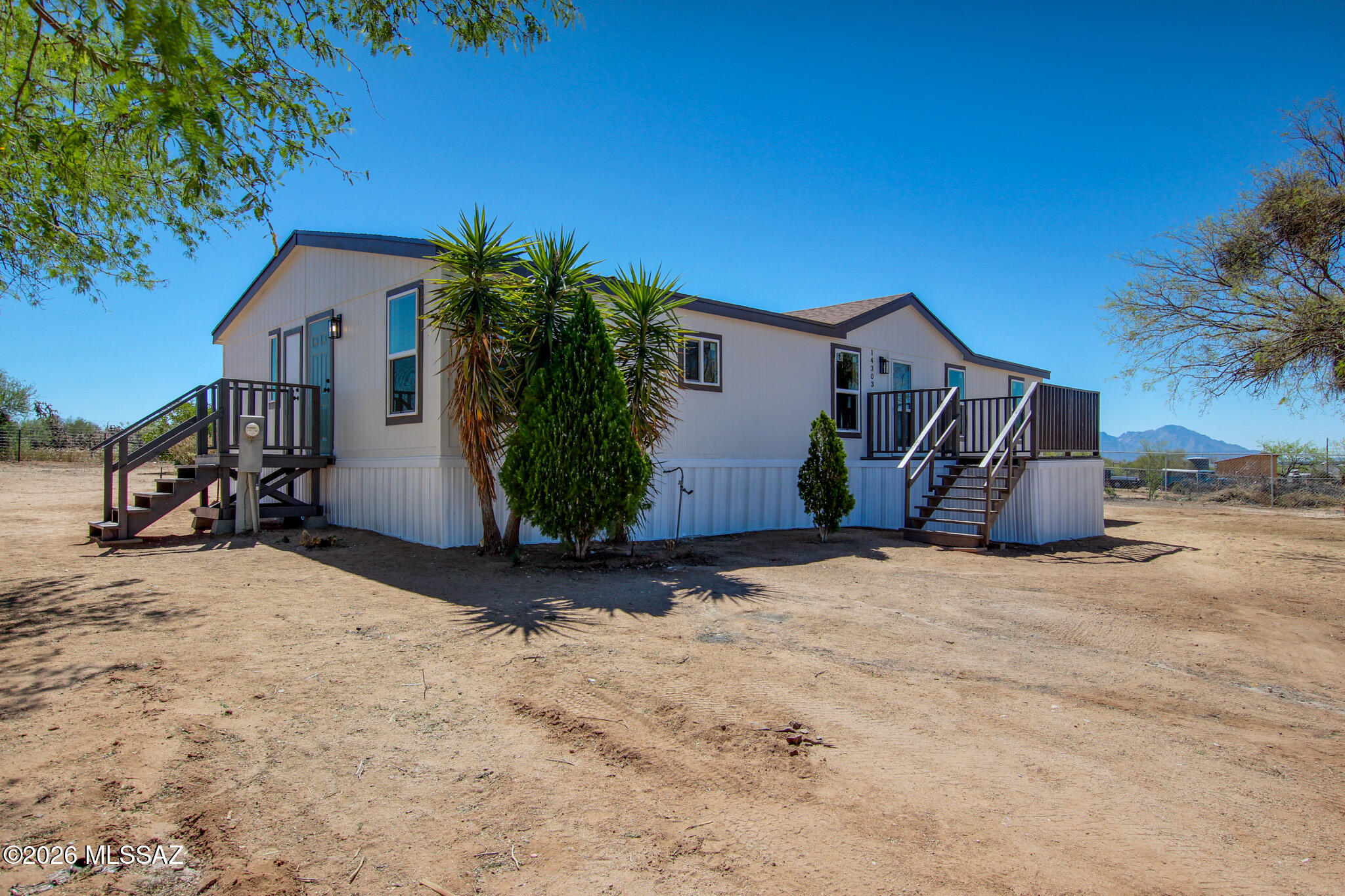 14303 West Rolina Lane Tucson, AZ 85736 - Photo 29 of 38 a view of a house with wooden fence and floor