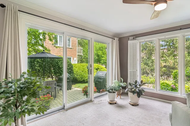 a view of a room with furniture and garden view