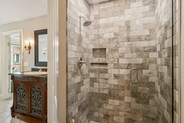 a bathroom with a shower and a sink