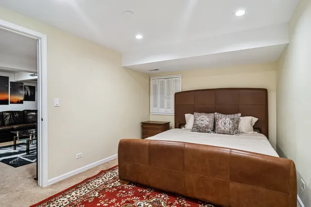 a bedroom with a bed and a cabinets