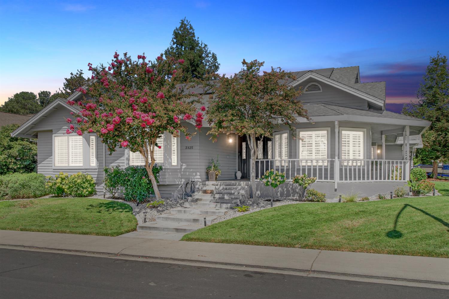 a front view of a house with garden