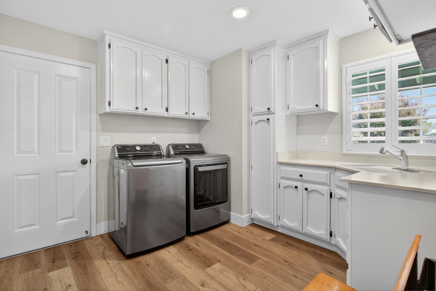 2325 Rio Verde Drive Riverbank, CA 95367 - Photo 18 of 43 a kitchen with granite countertop white cabinets and white appliances
