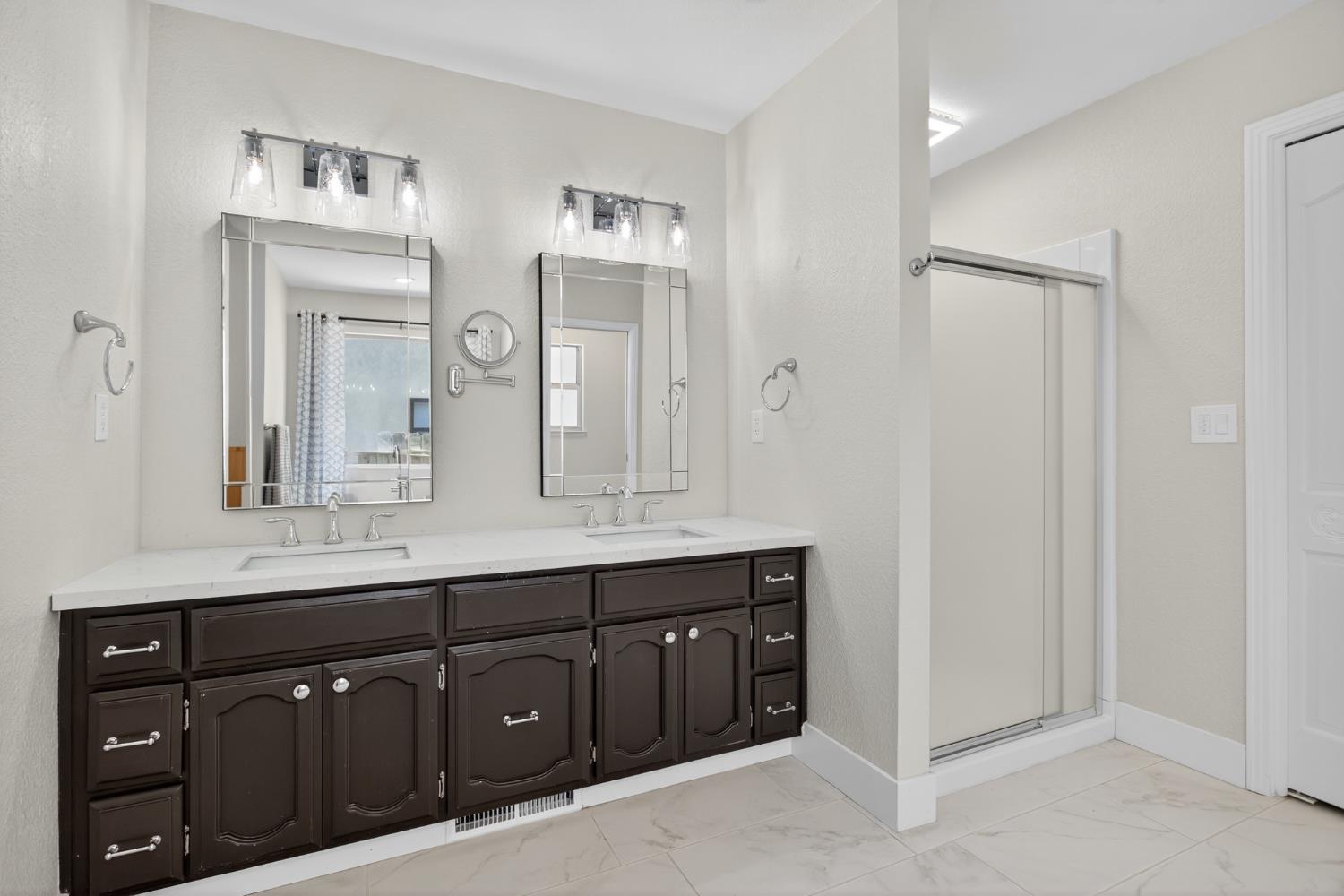 2325 Rio Verde Drive Riverbank, CA 95367 - Photo 29 of 43 a bathroom with a double vanity sink and mirror