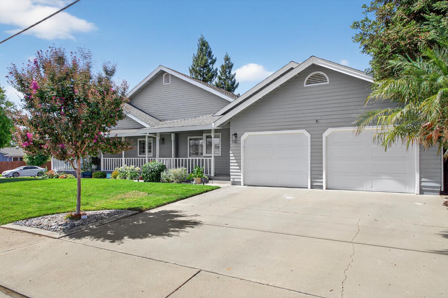 2325 Rio Verde Drive Riverbank, CA 95367 - Photo 4 of 43 a front view of a house with a yard and garage