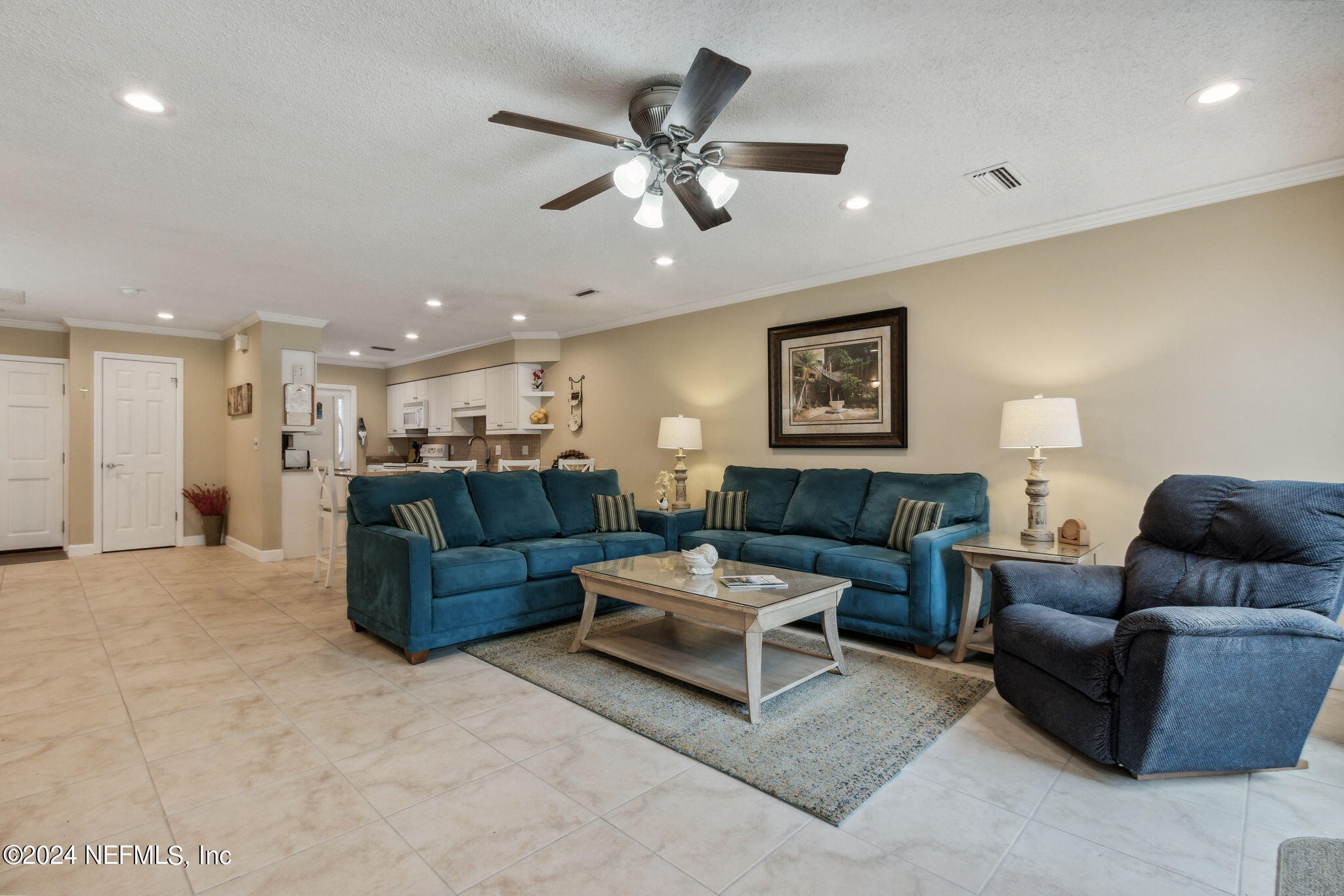 3327 Sea Marsh Road Fernandina Beach, FL 32034 - Photo 10 of 39 a living room with furniture and a ceiling fan