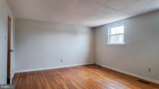 a bathroom with a toilet and a bathtub