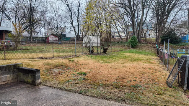 a view of swimming pool with a yard