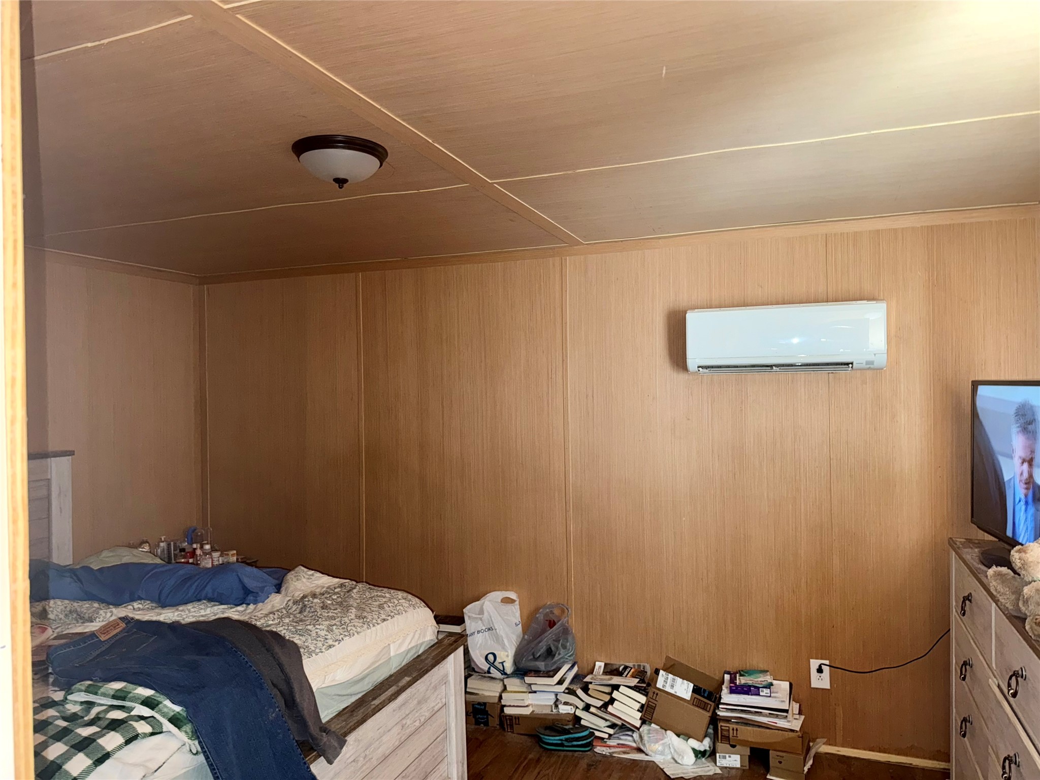 369 East Chestnut Avenue Winnie, TX 77665 - Photo 17 of 20 a bedroom with a bed and a tv