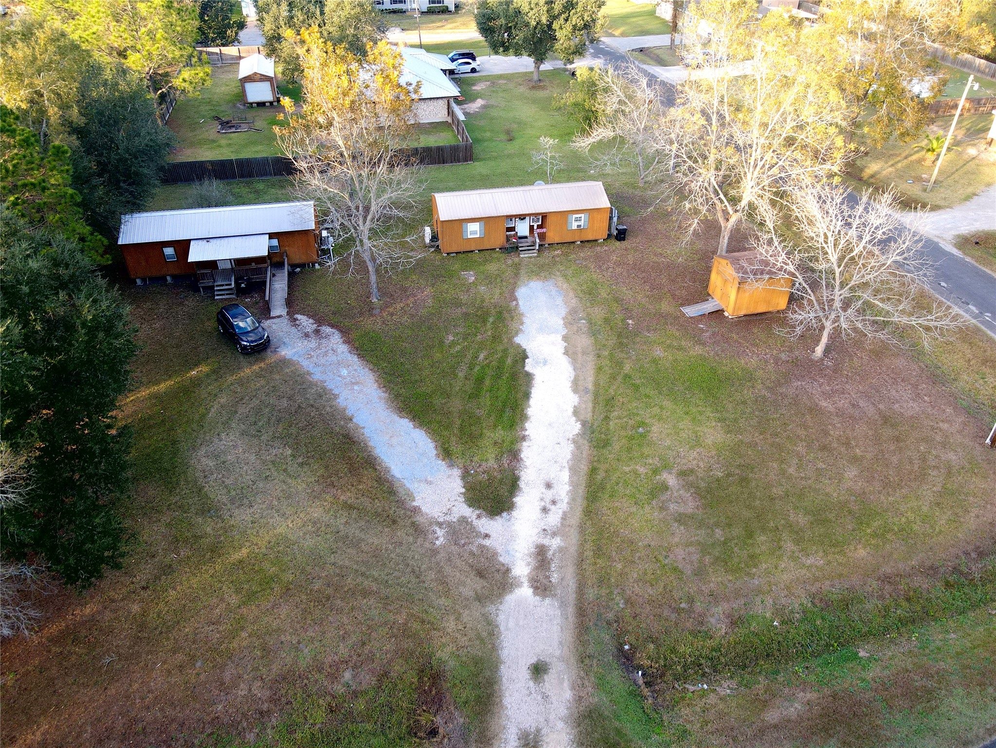 369 East Chestnut Avenue Winnie, TX 77665 - Photo 2 of 20 a swimming pool with outdoor seating and trees