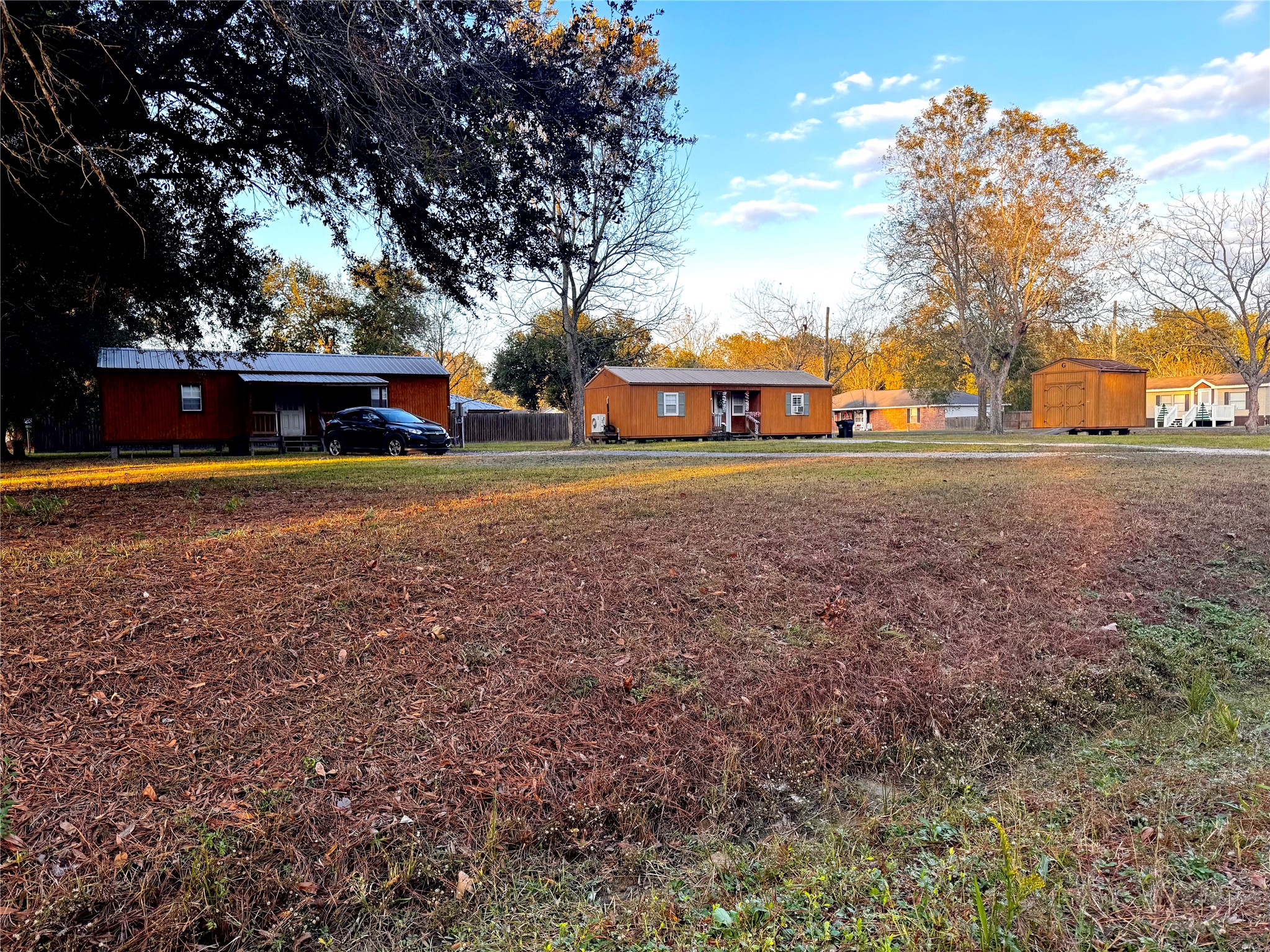 369 East Chestnut Avenue Winnie, TX 77665 - Photo 3 of 20 a front view of house with yard and trees