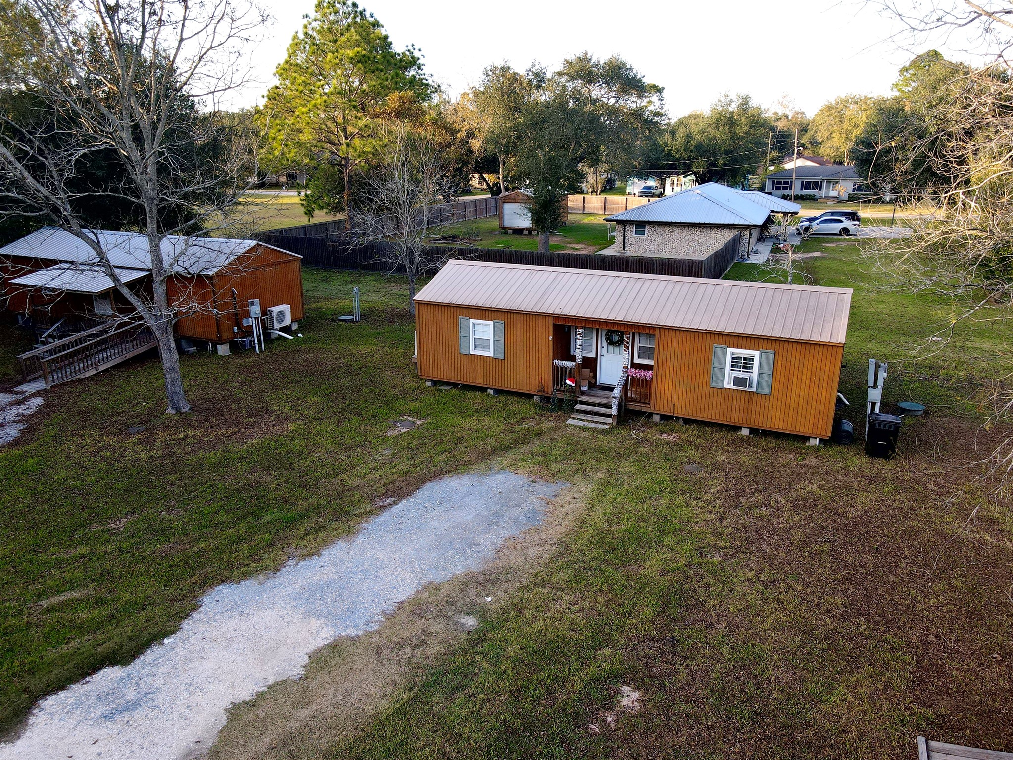 369 East Chestnut Avenue Winnie, TX 77665 - Photo 4 of 20 an aerial view of a house with garden space and street view
