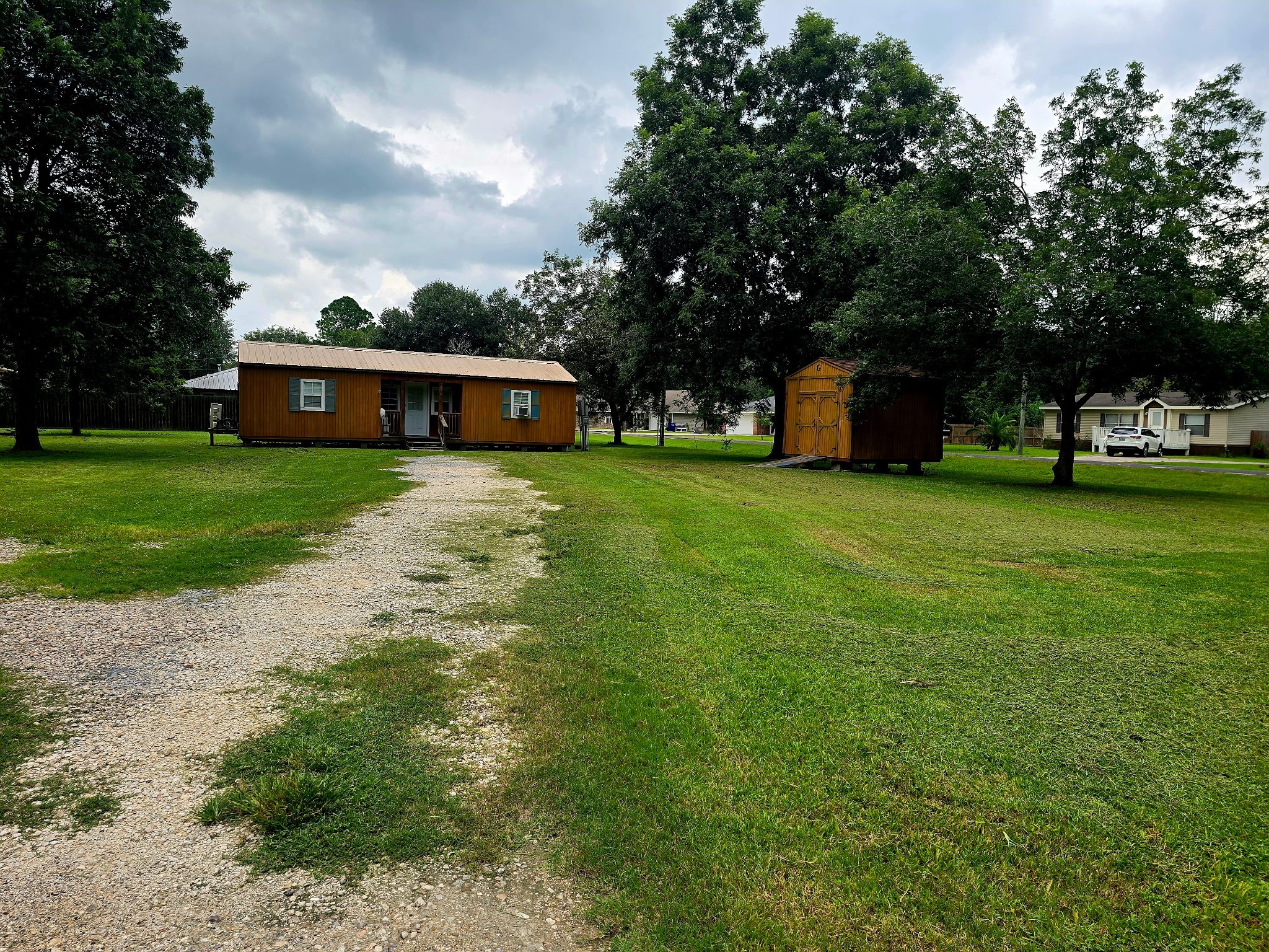 369 East Chestnut Avenue Winnie, TX 77665 - Photo 7 of 20 a front view of a house with garden