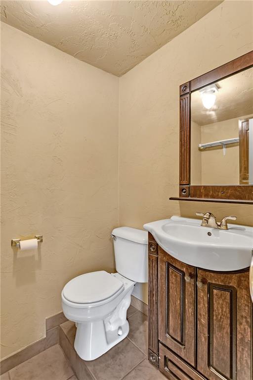2665 Berlin Farm Road Export, PA 15632 - Photo 20 of 39 a bathroom with a toilet a sink and mirror