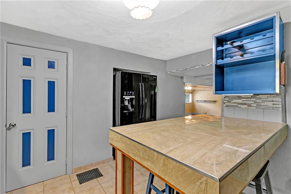 2665 Berlin Farm Road Export, PA 15632 - Photo 24 of 39 a kitchen with kitchen island a sink and wooden floor