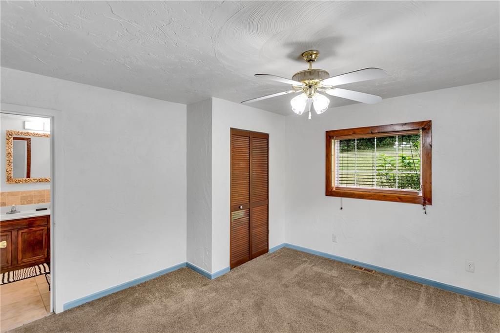 2665 Berlin Farm Road Export, PA 15632 - Photo 35 of 39 an empty room with windows and fan