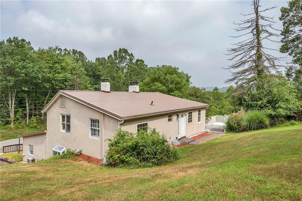 2665 Berlin Farm Road Export, PA 15632 - Photo 5 of 39 a aerial view of a house with yard and trees in the background