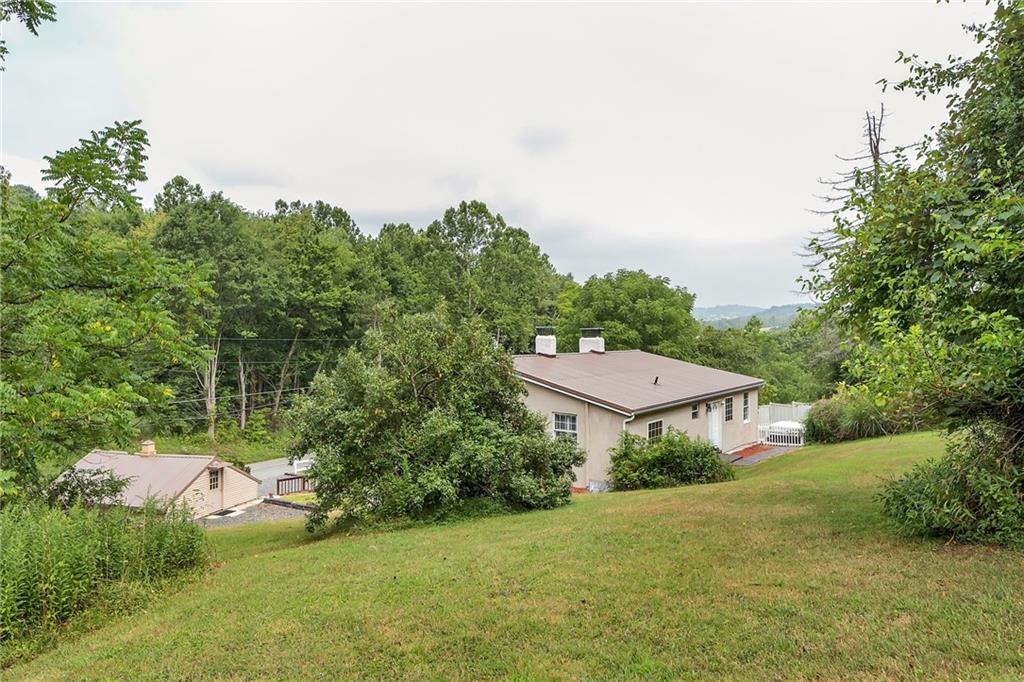 2665 Berlin Farm Road Export, PA 15632 - Photo 7 of 39 a view of a house with a yard and a garden