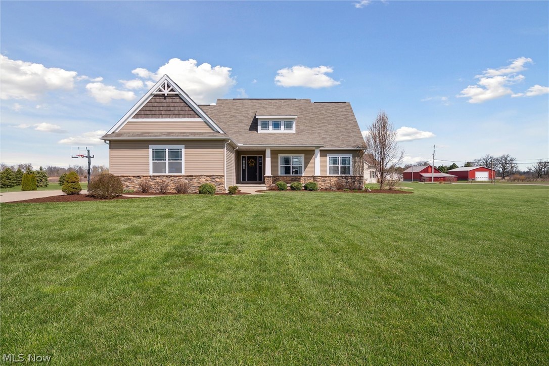405 East Luchsinger Road Port Clinton, OH 43452 - Photo 1 of 40 Craftsman-style house with a front lawn