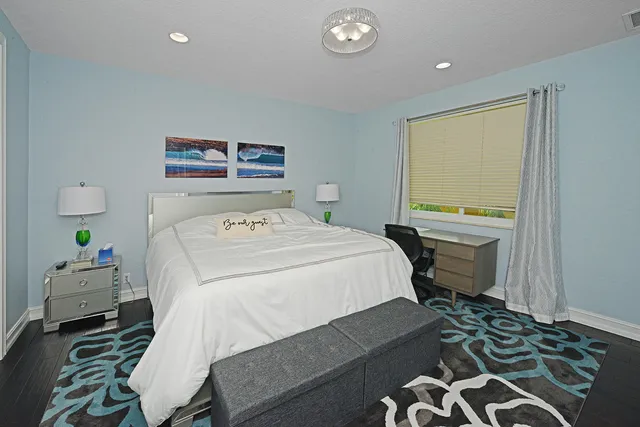 a bathroom with a double vanity sink toilet and shower