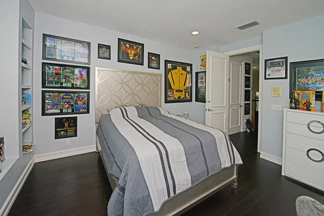 a living room with patio furniture and garden view