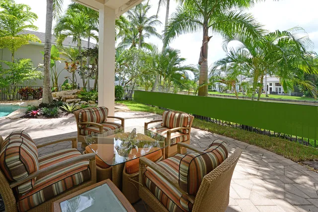 a view of a house with backyard and porch